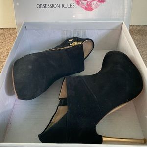 Obsession Rules, suede black booties, stilettos.